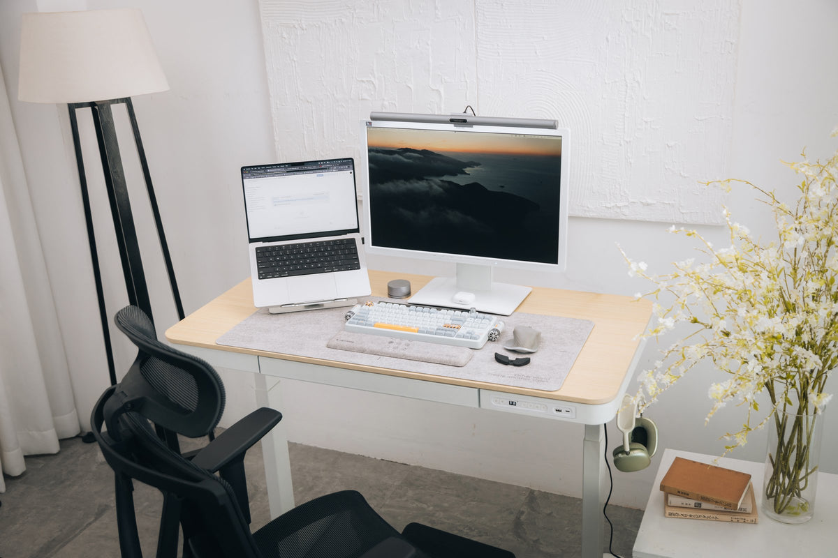 Light oak desk with a monitor light