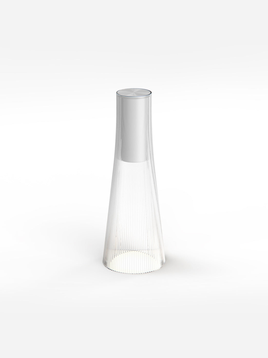 The clear Candel lamp, a tapered fluted cone with a silver cap, glowing at the base on a pale background