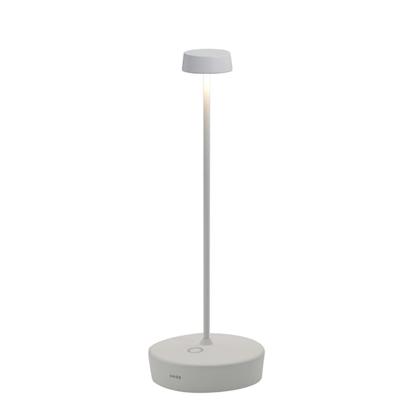 The white Swap Pro lamp, a slim stem with a small round head on a low round base, on a white background