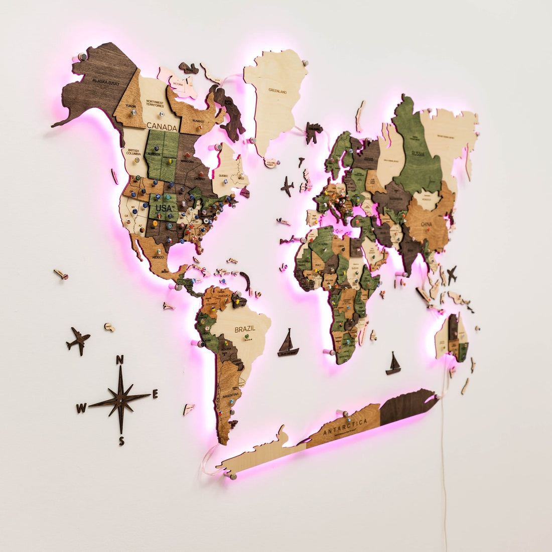 The whole map lit in pink and green with a compass and small wooden ship