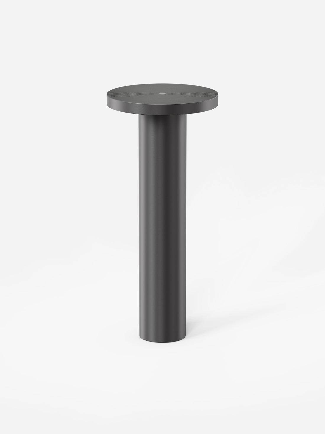 The black Luci lamp on a light grey background