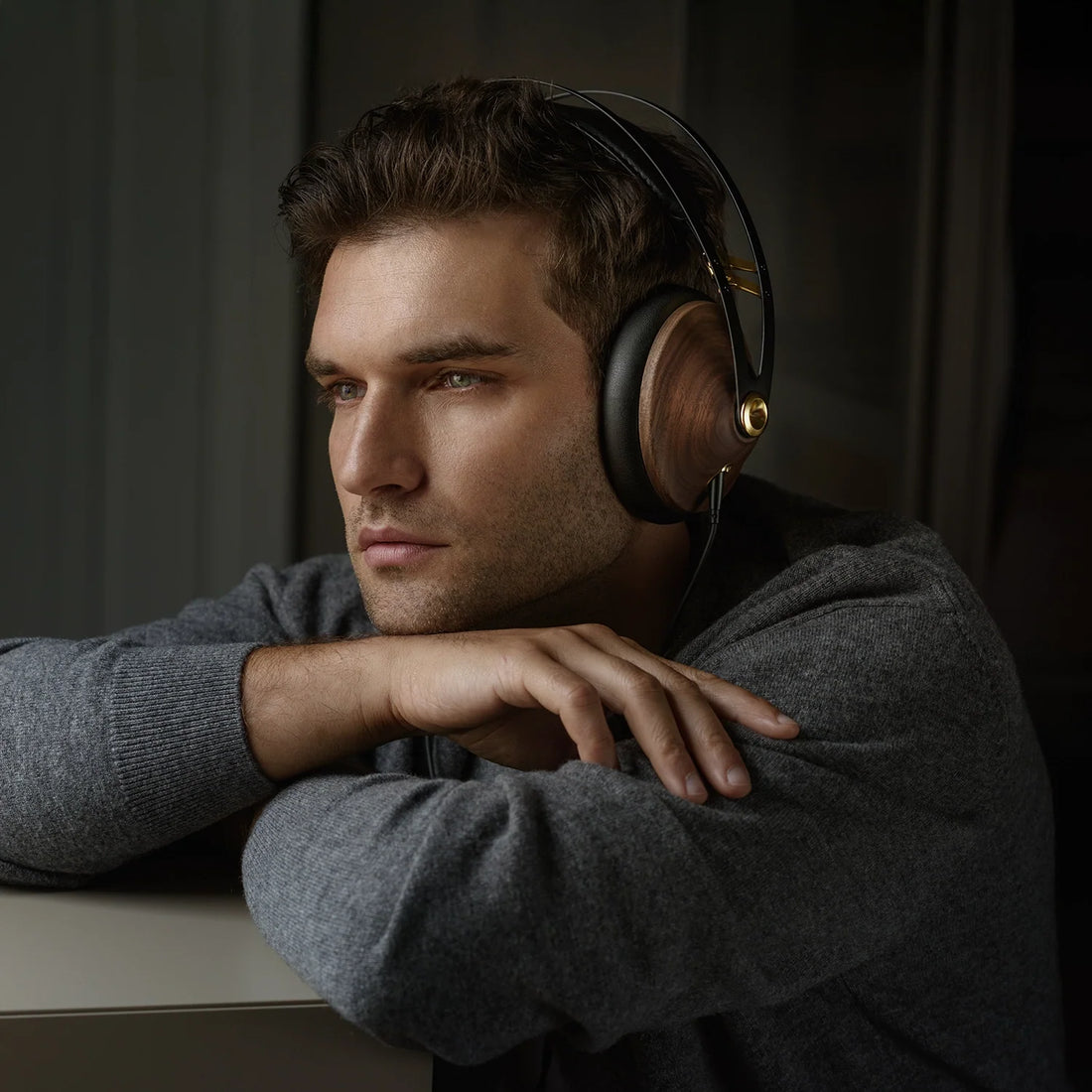Person wearing the headphones in a dim room