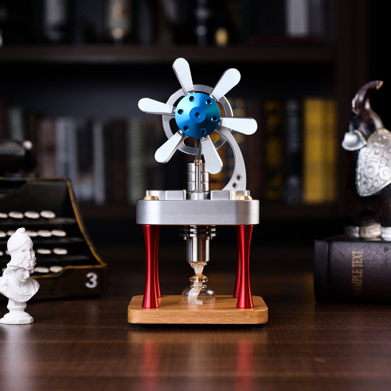 Metal Stirling engine with a six-blade blue propeller on red legs and a bamboo base, dark bookshelf behind