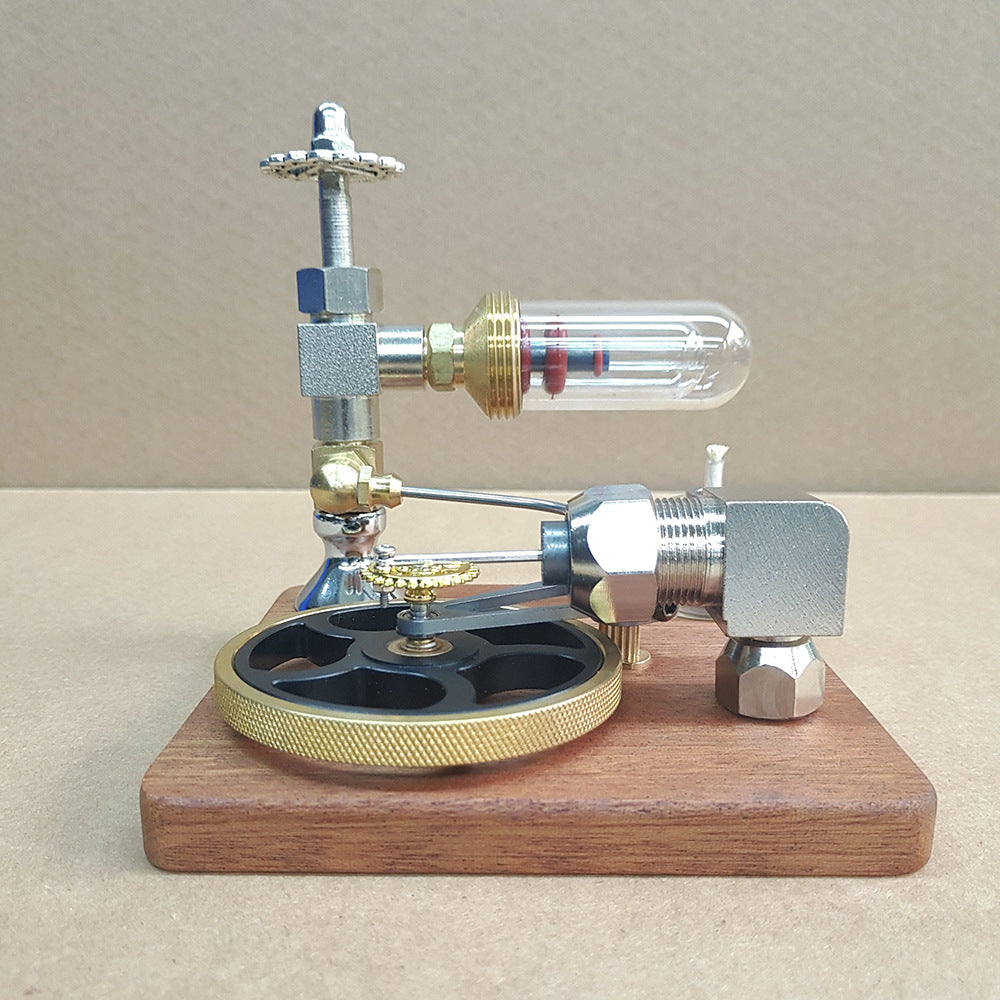 Stirling engine model side view with the black and gold flywheel