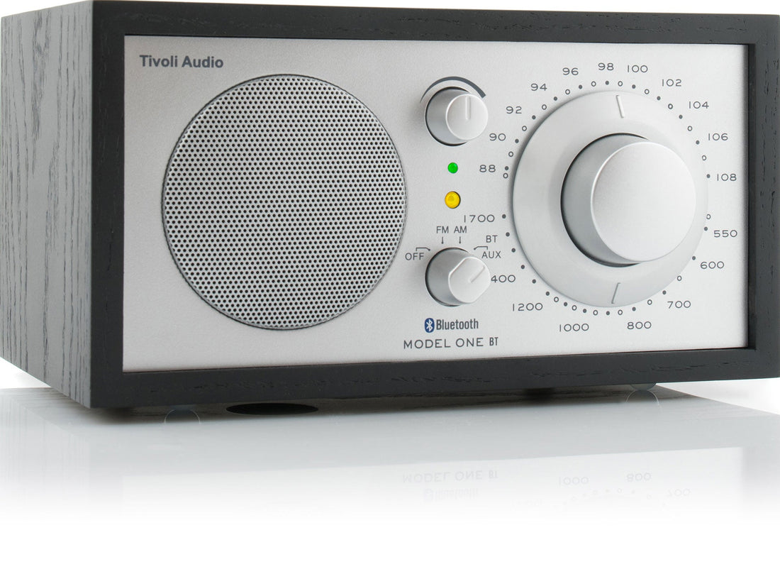 Black ash cabinet radio with a silver face at an angle