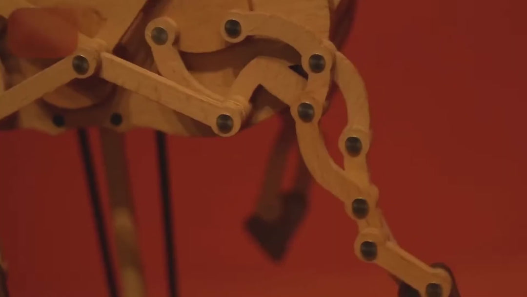 Close view of the horse's pinned wooden legs folding and reaching as it gallops, ending on the whole horse on its base.