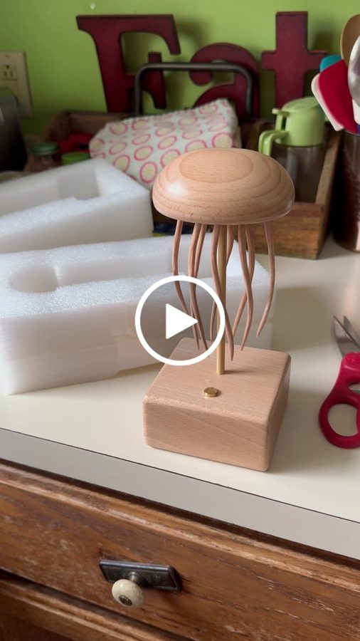 Vickie P.: Jellyfish automaton on a desk beside foam packing and office items, from an owner clip.