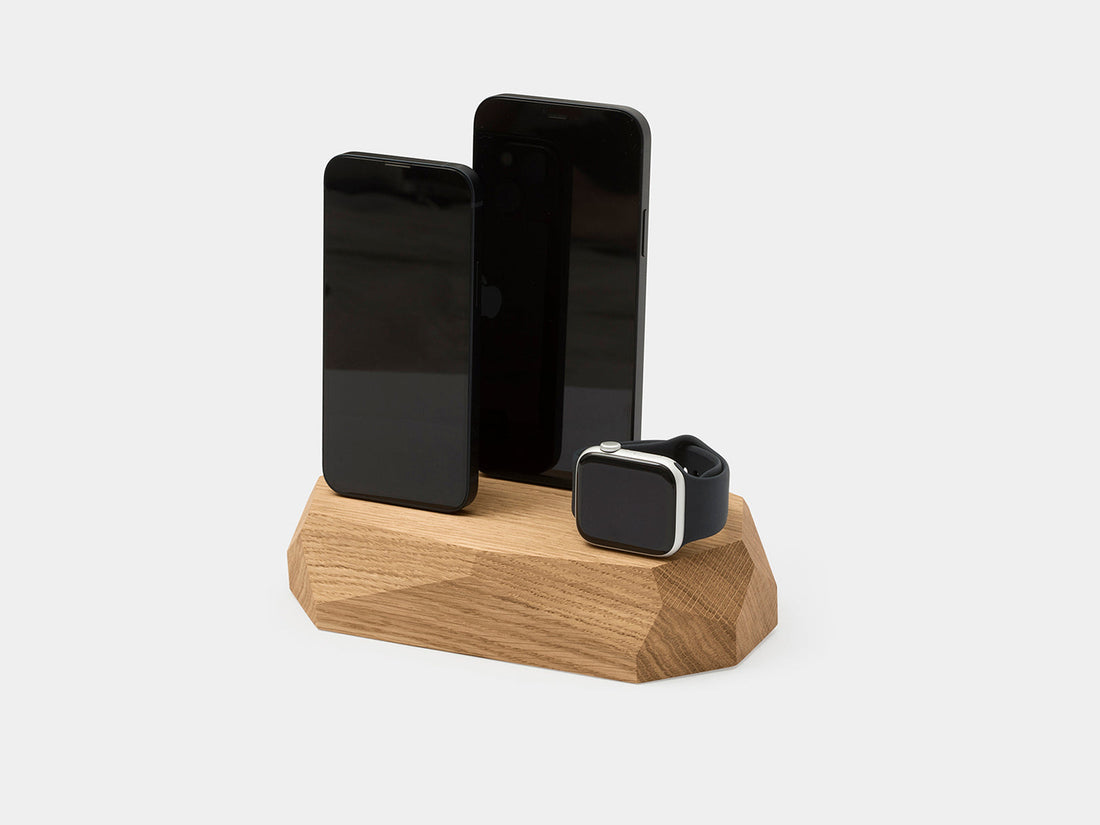 Oak dock holding two phones and a watch